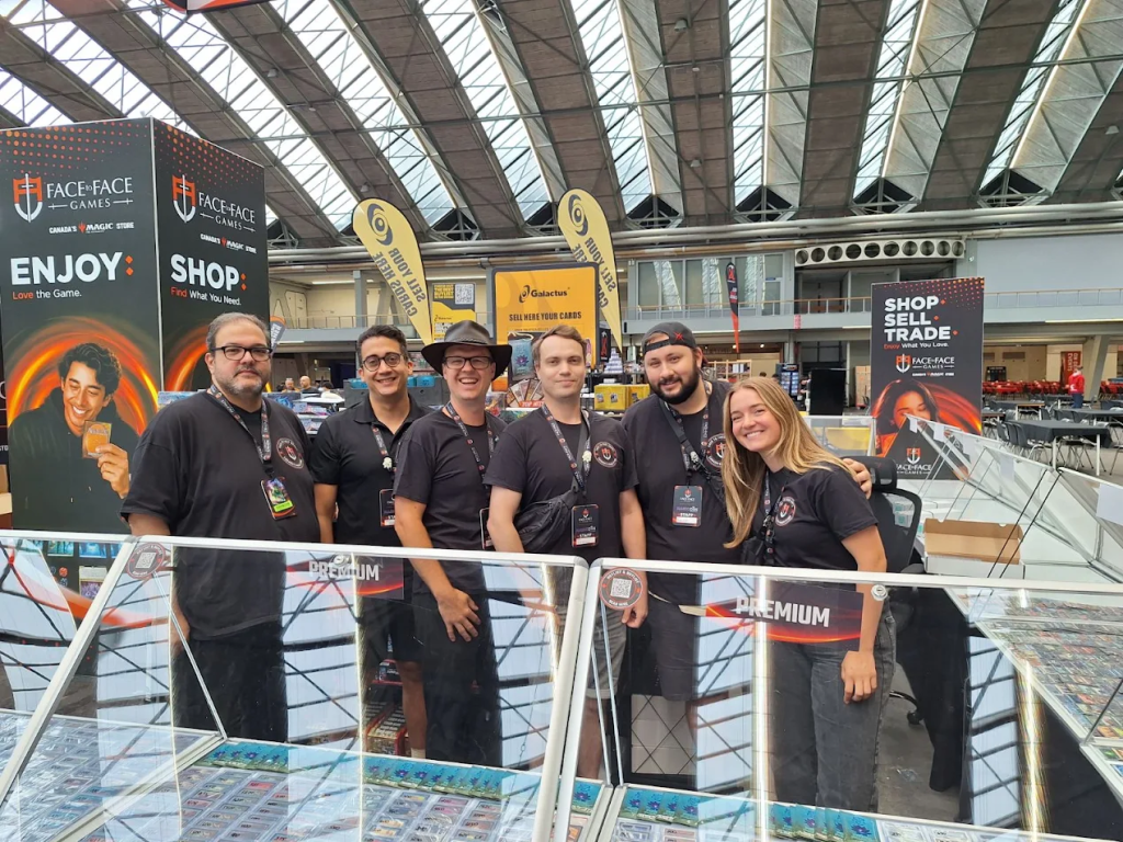The Face to Face Games team group photo at the booth
