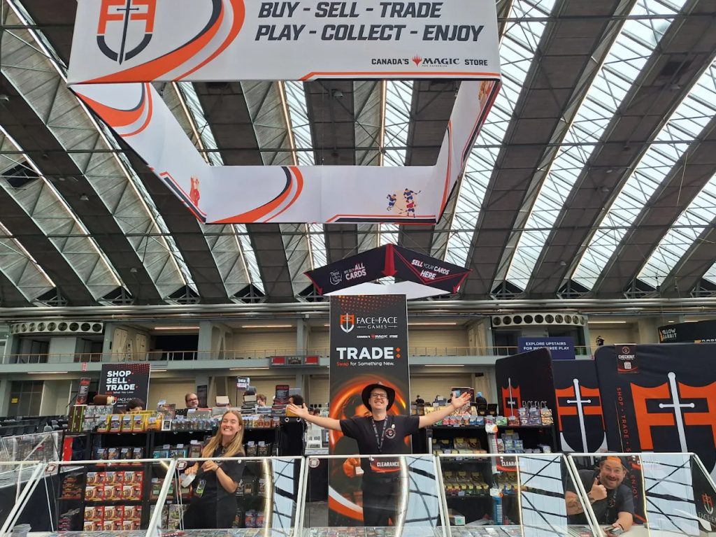 Face to Face Games staff welcoming players into the booth