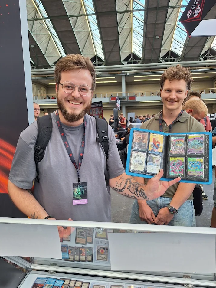 Happy customers showing off a binder of pulls