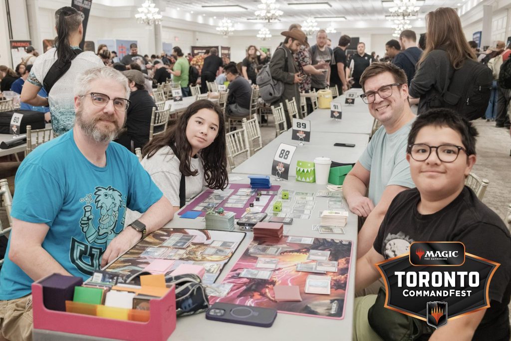 A packed hall behind a Commander pod at F2F Tour Toronto CommandFest 2026